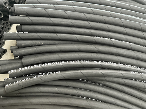 What are the black industrial chemical delivery hoses?